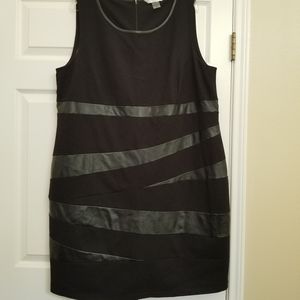 Sleeveless black dress.
